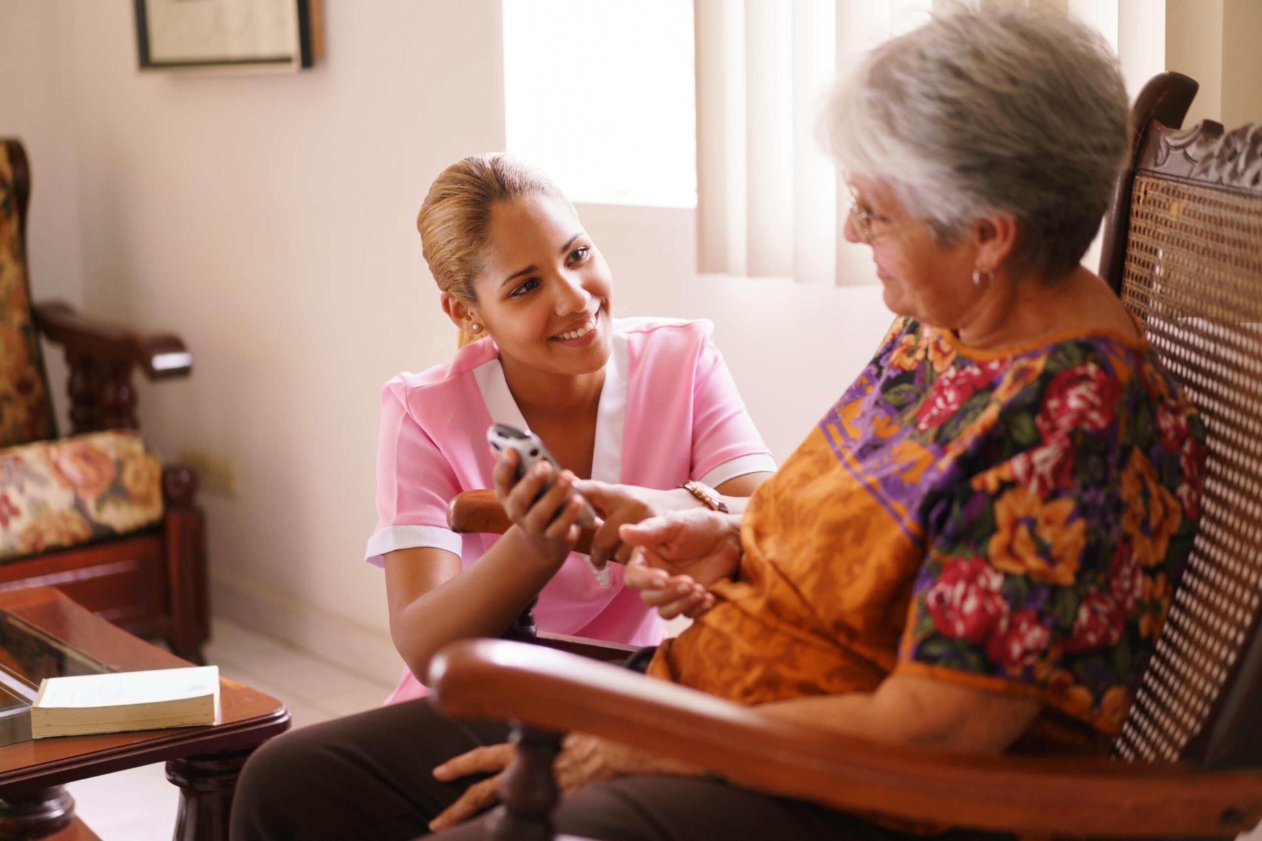 Caregiver providing compassionate support to elderly resident