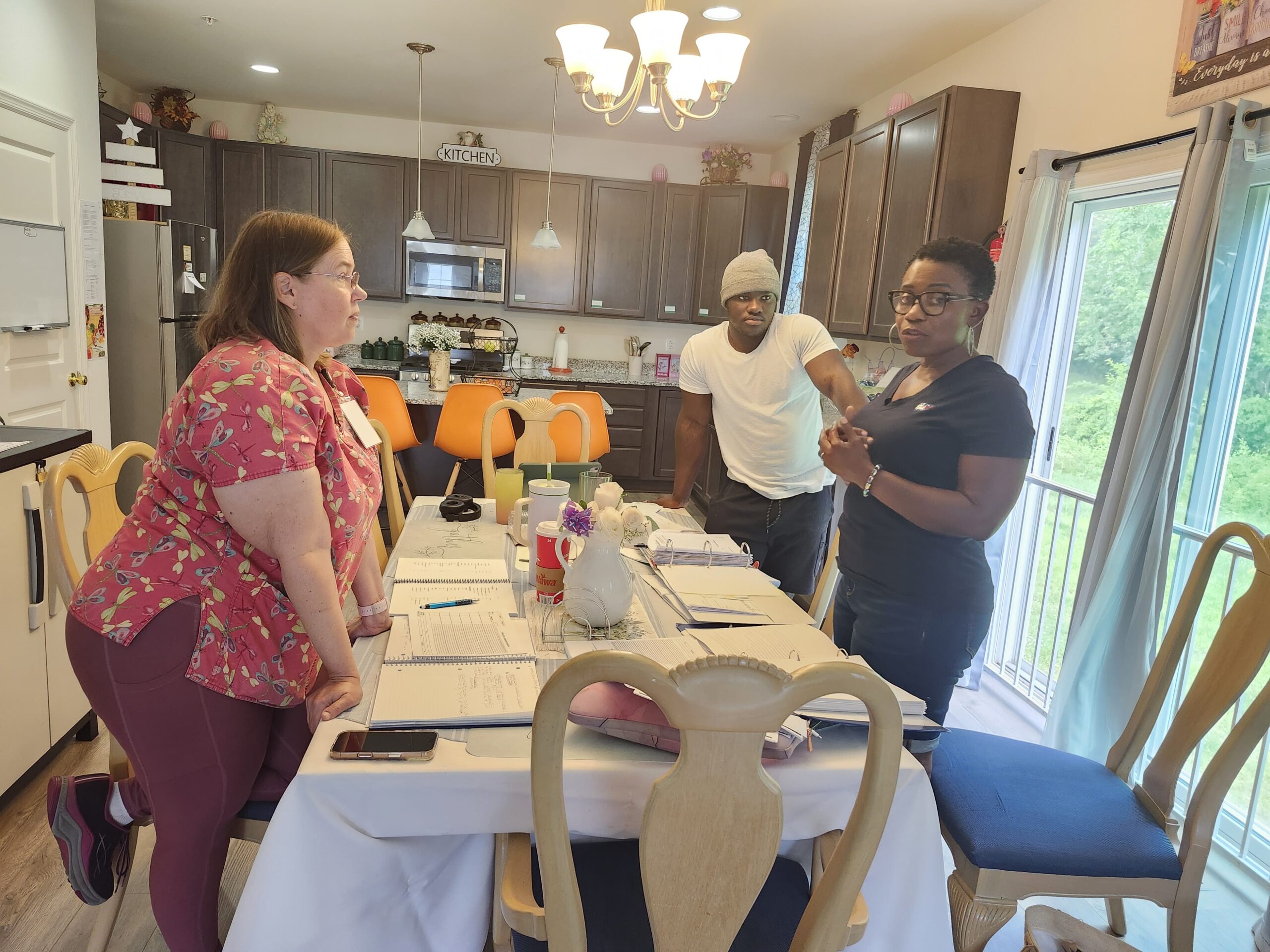 Care team discussing resident care plans in assisted living facility