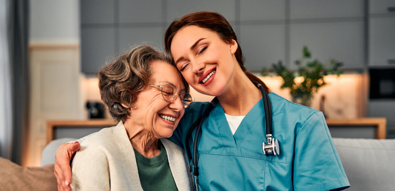 Senior caregiver offering companionship and assistance to elderly woman