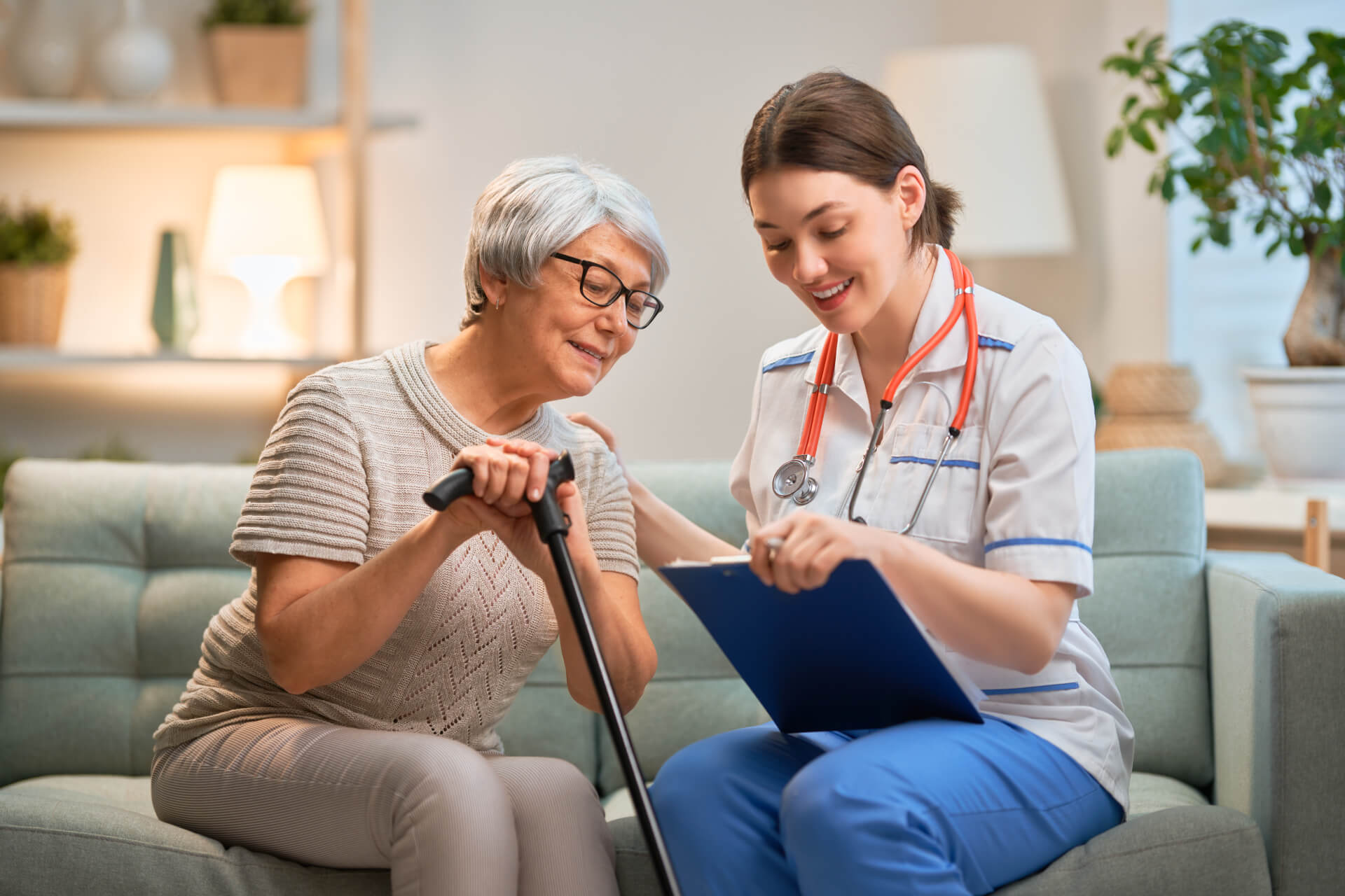 Senior woman receiving care support and health assistance at home