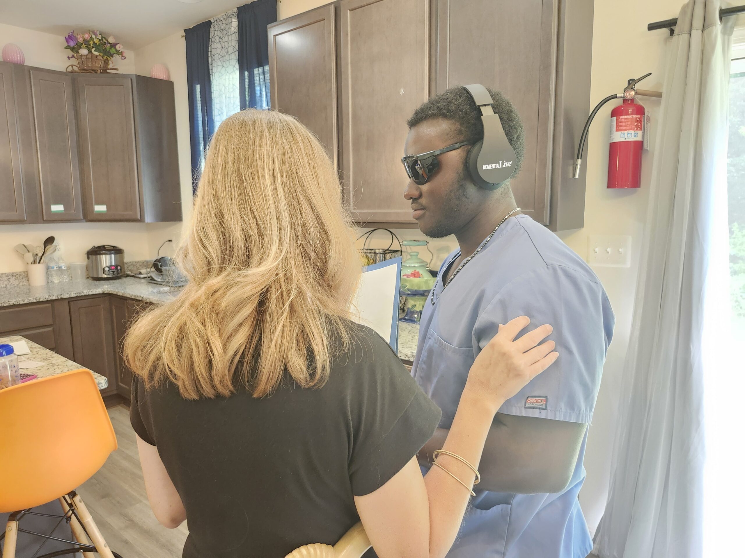 Caregiver supporting resident during daily activities