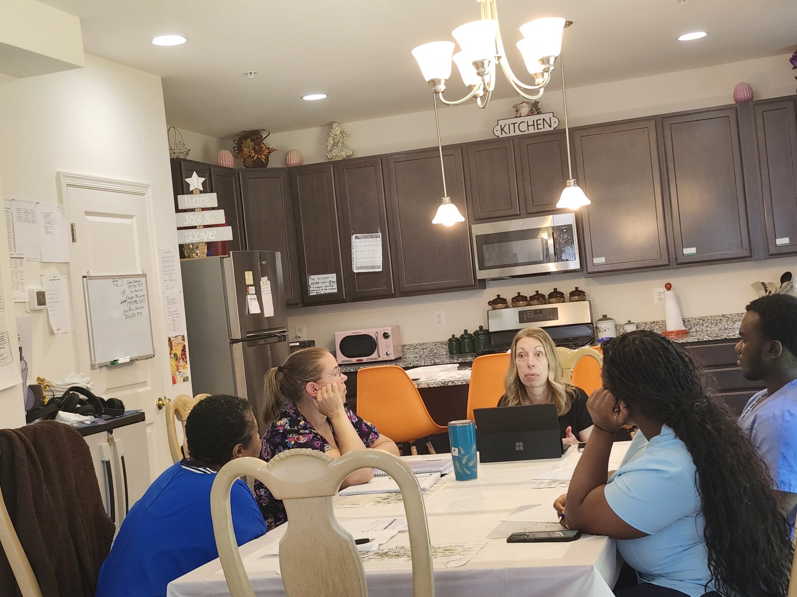 Care team meeting and discussing resident care plans