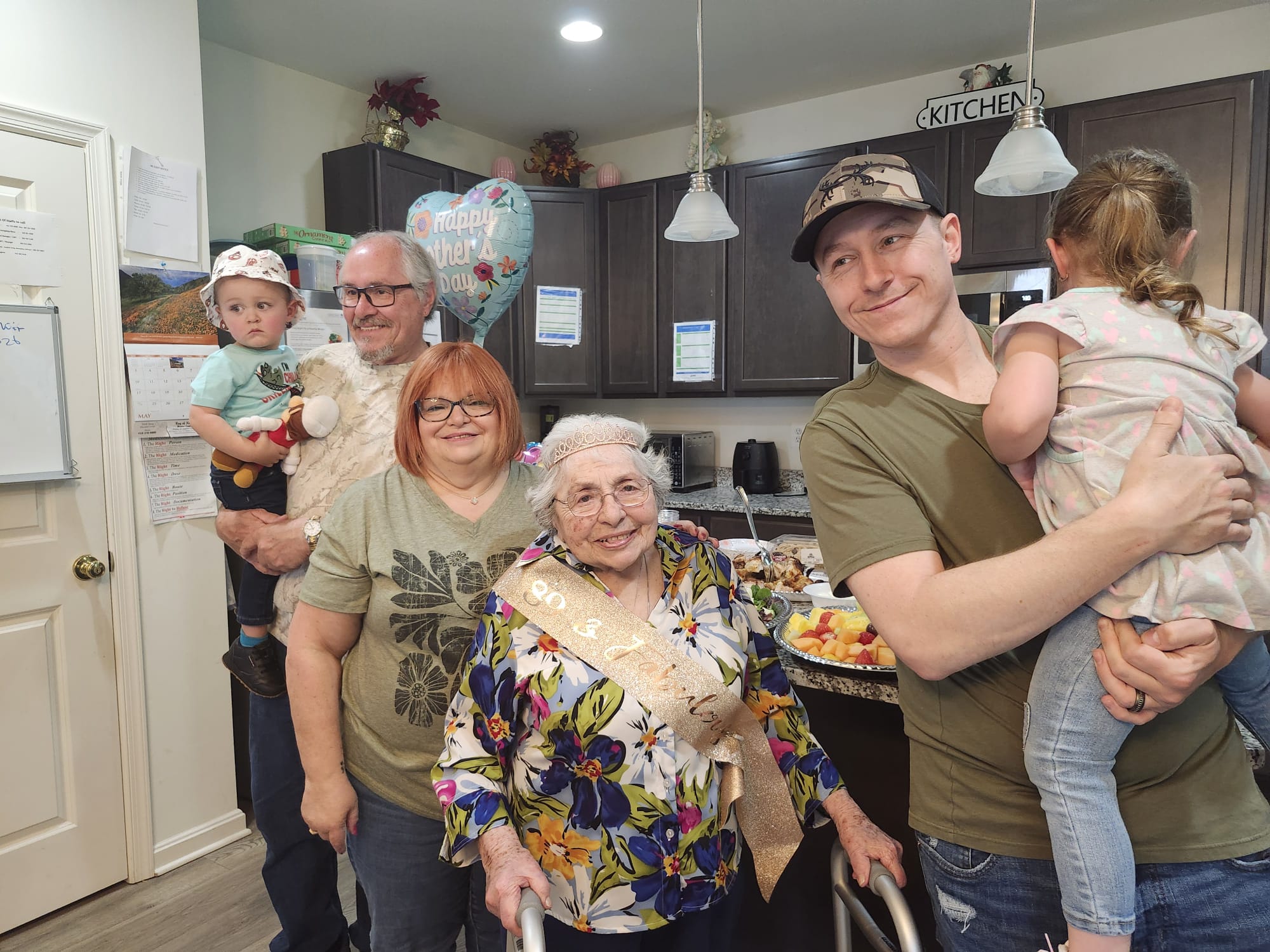 Family members visiting senior resident in assisted living home