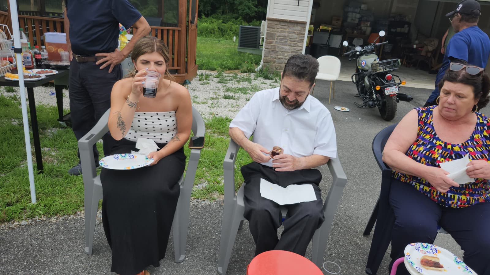 Residents enjoying a community gathering with family and caregivers