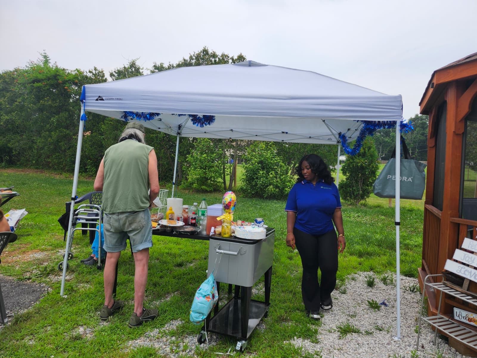 Caregiver and resident enjoying an outdoor assisted living activity